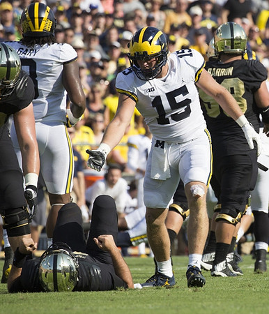 Rashan Gary (3) and Chase Winovich (15)
