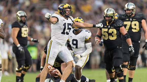 Chase Winovich (15) and Mike McCray (9)