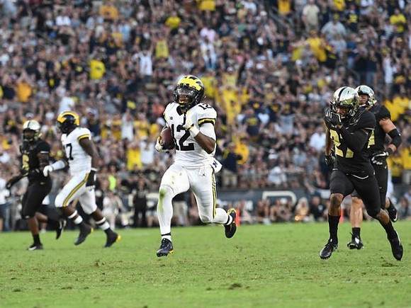 Tyrone Wheatley Jr. (17) and Chris Evans (12)