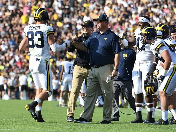 Zach Gentry (83), Jim Harbaugh, Greg Frey, Tyrone Wheatley Jr. (17), and Sean McKeon (84)