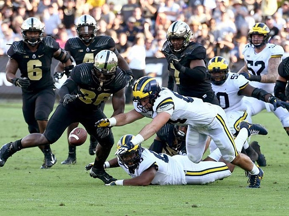 Khalid Hill (80), Sean McKeon (84), Michael Onwenu (50), and Mason Cole (52)