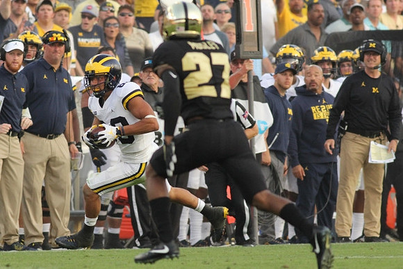Grant Perry (88) and Jim Harbaugh