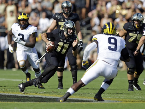 Rashan Gary (3) and Mike McCray (9)