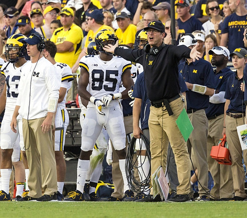 Maurice Ways (85) and Jim Harbaugh
