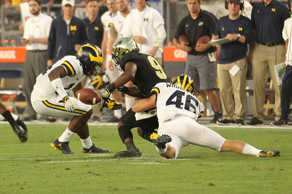 Josh Metellus (14) and Michael Wroblewski (46)