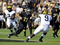 Rashan Gary (3) and Mike McCray (9)