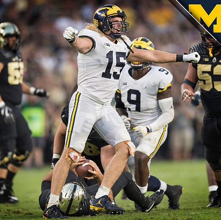 Chase Winovich (15) and Mike McCray (9)