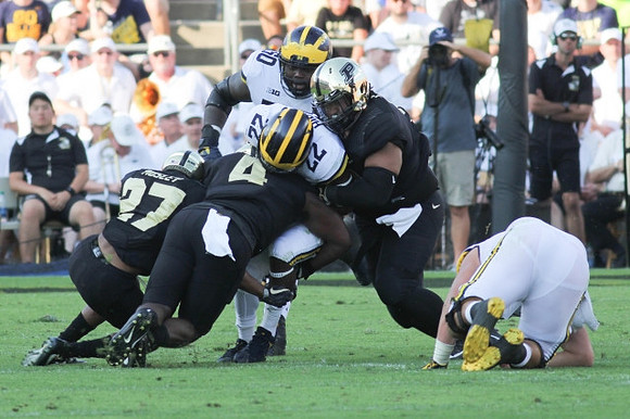 Karan Higdon (22) and Michael Onwenu (50)