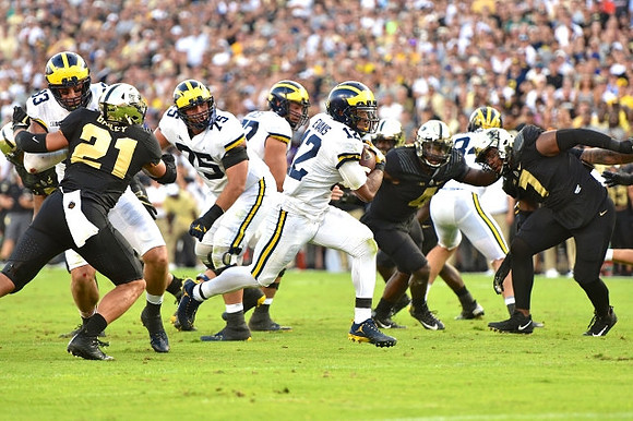 Zach Gentry (83), Jon Runyan Jr. (75), and Chris Evans (12)