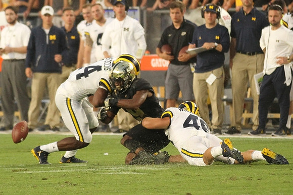 Josh Metellus (14) and Michael Wroblewski (46)