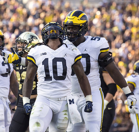 Devin Bush (10) and Michael Dwumfour (50)