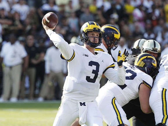 Wilton Speight (3) and Mason Cole (52)