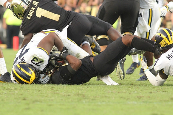 Maurice Hurst (73) and Mike McCray (9)