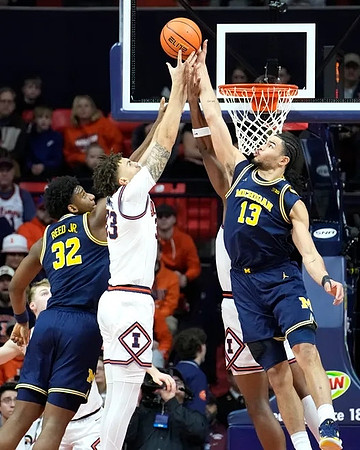Tarris Reed Jr. (32) and Olivier Nkamhoua (13)