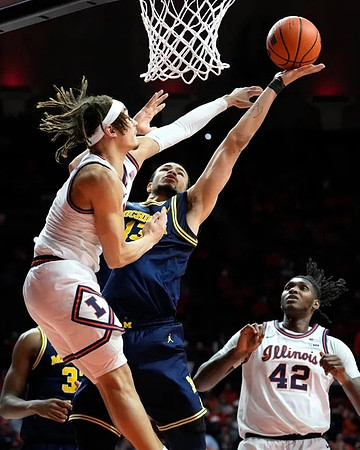 Olivier Nkamhoua (13) and Tarris Reed Jr. (32)