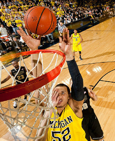 Jordan Morgan (52) and Trey Burke (3)
