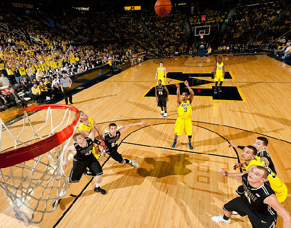 Evan Smotrycz (23), Stu Douglass (1), Trey Burke (3), Tim Hardaway Jr. (10), and Jordan Morgan (52)