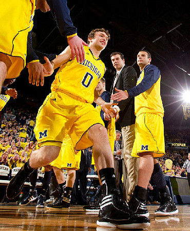 Zack Novak (0), Ben Cronin, and Josh Bartelstein (20)