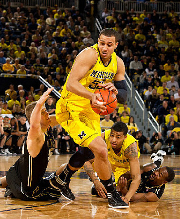 Jordan Morgan (52) and Trey Burke (3)