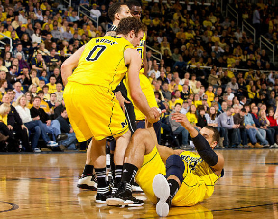 Zack Novak (0), Tim Hardaway Jr. (10), and Jordan Morgan (52)