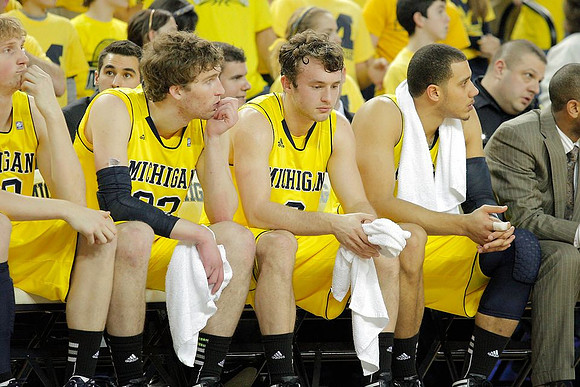 Blake McLimans (22), Evan Smotrycz (23), Zack Novak (0), and Jordan Morgan (52)