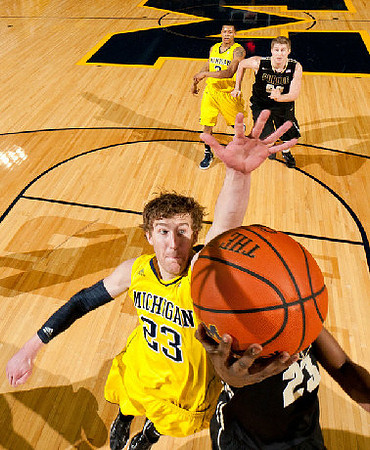 Evan Smotrycz (23) and Trey Burke (3)