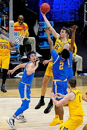 Eli Brooks (55), Hunter Dickinson (1), and Franz Wagner (21)