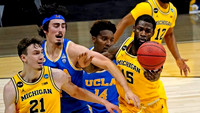 Franz Wagner (21), Chaundee Brown Jr. (15), and Mike Smith (12)