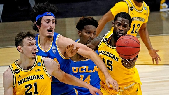 Franz Wagner (21), Chaundee Brown Jr. (15), and Mike Smith (12)