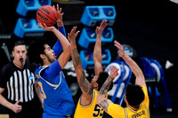 Eli Brooks (55) and Brandon Johns Jr. (23)