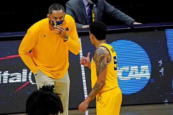 Juwan Howard and Eli Brooks (55)