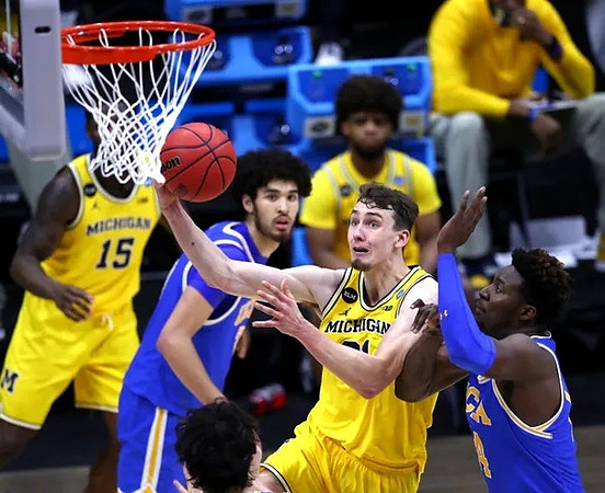 Franz Wagner (21), Chaundee Brown Jr. (15), and Mike Smith (12)