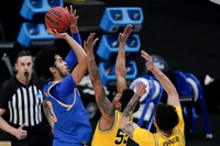 Eli Brooks (55) and Brandon Johns Jr. (23)
