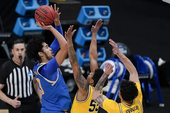 Eli Brooks (55) and Brandon Johns Jr. (23)