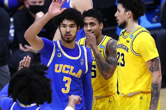 Eli Brooks (55) and Brandon Johns Jr. (23)