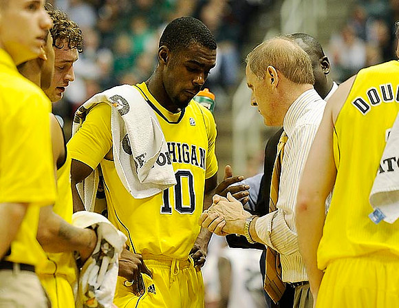 Zack Novak (0), Tim Hardaway Jr. (10), John Beilein, Bacari Alexander, and Stu Douglass (1)