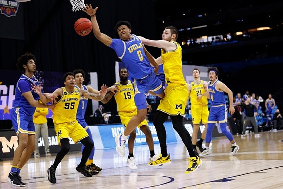 Eli Brooks (55), Chaundee Brown Jr. (15), Hunter Dickinson (1), and Franz Wagner (21)
