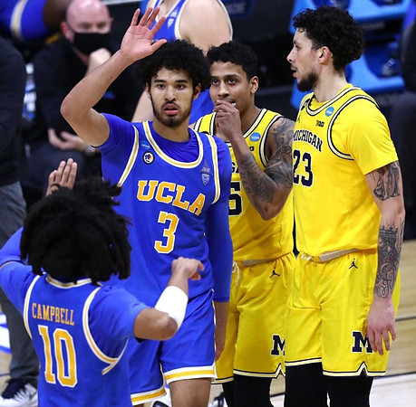 Eli Brooks (55) and Brandon Johns Jr. (23)