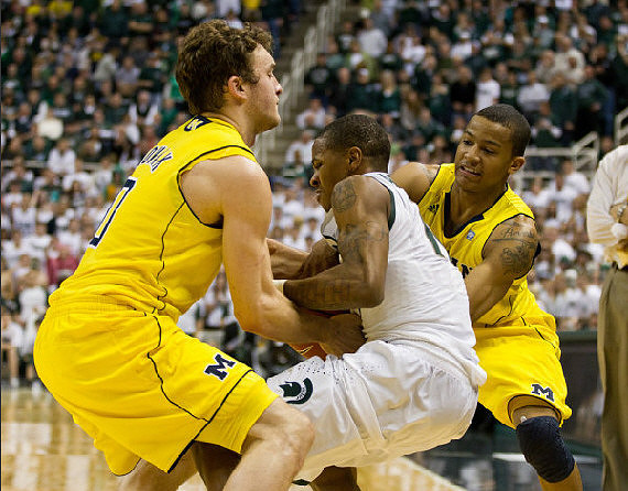 Zack Novak (0) and Trey Burke (3)