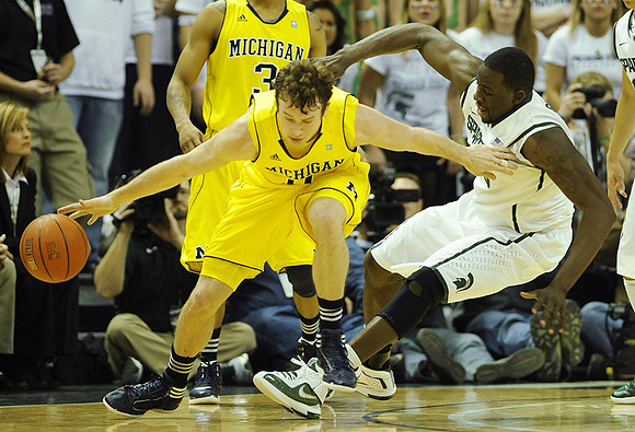 Zack Novak (0) and Trey Burke (3)