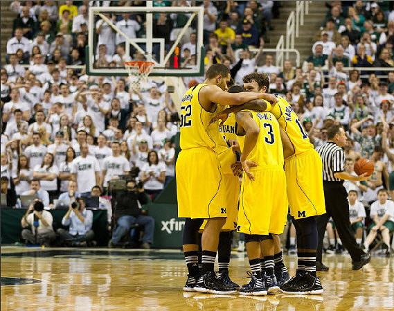 Jordan Morgan (52), Trey Burke (3), Tim Hardaway Jr. (10), and Zack Novak (0)