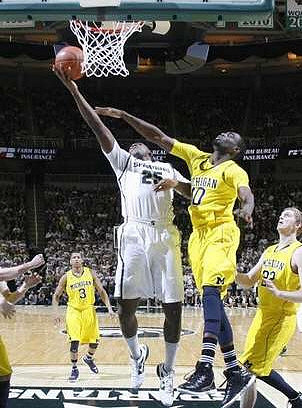 Trey Burke (3), Tim Hardaway Jr. (10), and Blake McLimans (22)