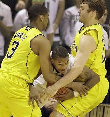 Trey Burke (3) and Zack Novak (0)