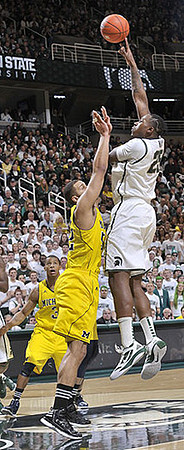 Trey Burke (3) and Jordan Morgan (52)