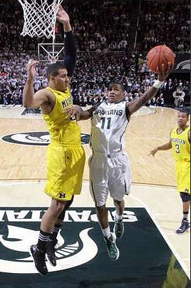 Jordan Morgan (52) and Trey Burke (3)