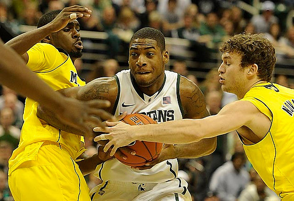 Tim Hardaway Jr. (10) and Zack Novak (0)
