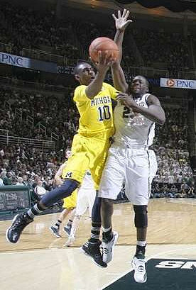 Tim Hardaway Jr. (10) and Zack Novak (0)