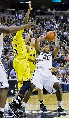 Tim Hardaway Jr. (10) and Zack Novak (0)