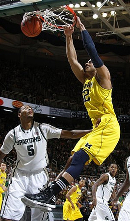 Jordan Morgan (52), Zack Novak (0), and Trey Burke (3)