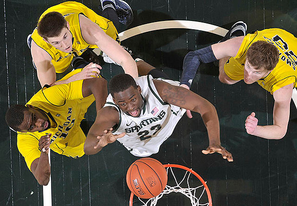 Tim Hardaway Jr. (10), Stu Douglass (1), and Evan Smotrycz (23)